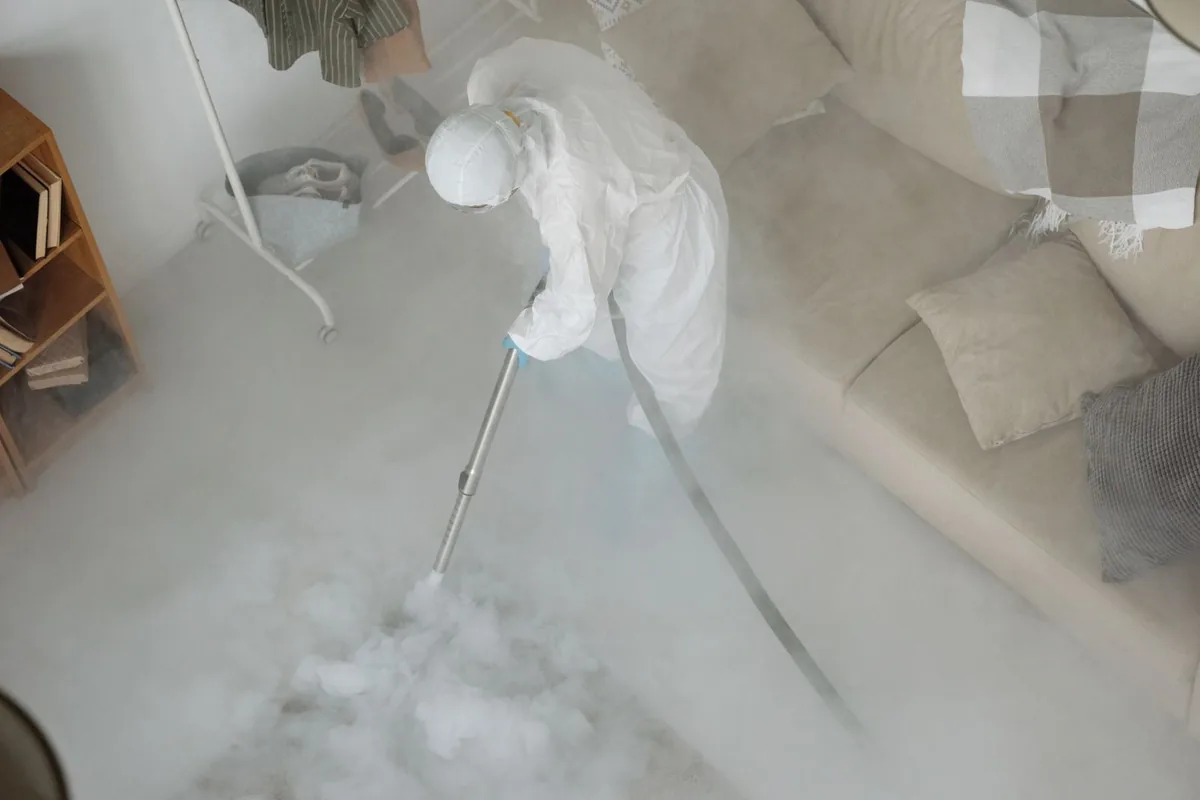 Biohazard cleanup technician in protective equipment, Forks, WA